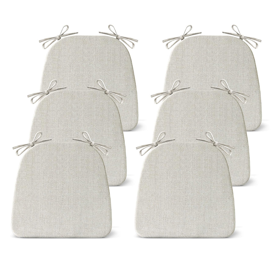 IASEAHK dining chair cushion set on a beige chair for added comfort.