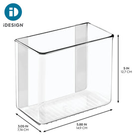 iDesign adhesive organizer bin inside washer-dryer area keeping small items organized