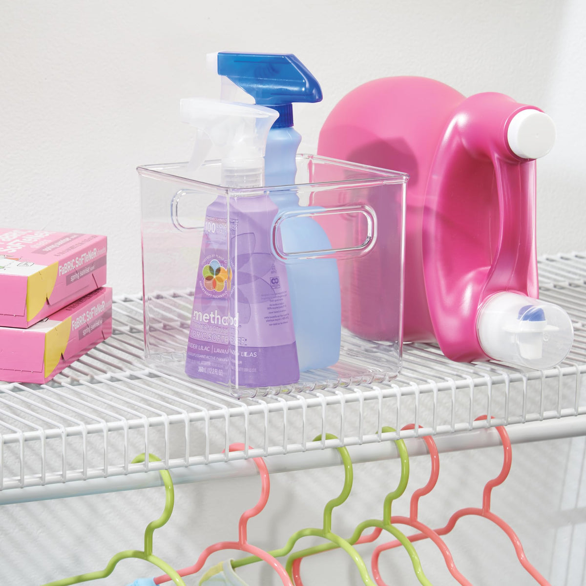 iDesign clear bin on a shelf with other containers for organized kitchen.