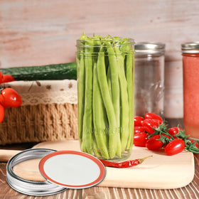 Ieavier pickling jar filled with tomatoes for fresh flavors.
