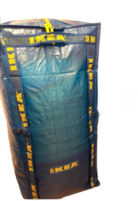 IKEA Frakta blue storage bag folded for compact carrying and quick organization.