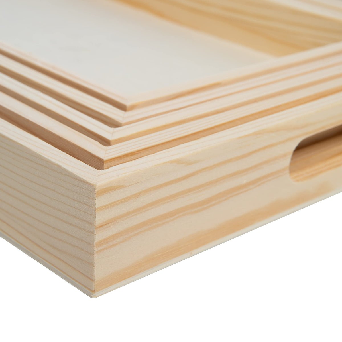 Creative Hobbies wooden nested trays used as a centerpiece display on a coffee table.