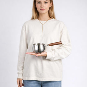 Wooden handle on IMEEA pot stays cool during use for safe stirring