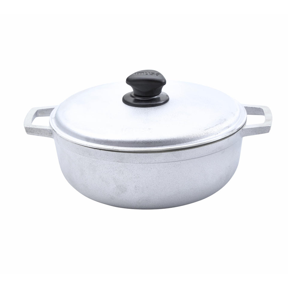 IMUSA Caldero lid and handles offer safe, easy maneuvering from stove to table.