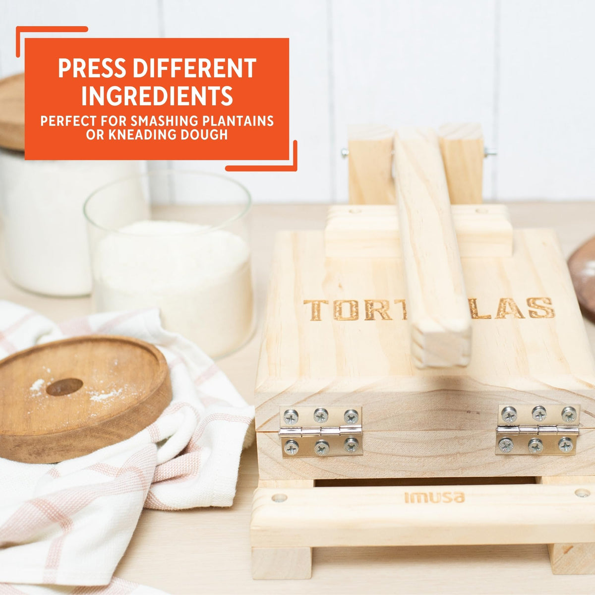 Imusa press in use, pressing dough for tortillas and arepas
