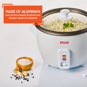 Imusa rice cooker with transparent lid for monitoring cooking progress.