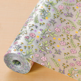INNOLITES floral shelf liner with pink-purple rose pattern protects cabinet shelves.