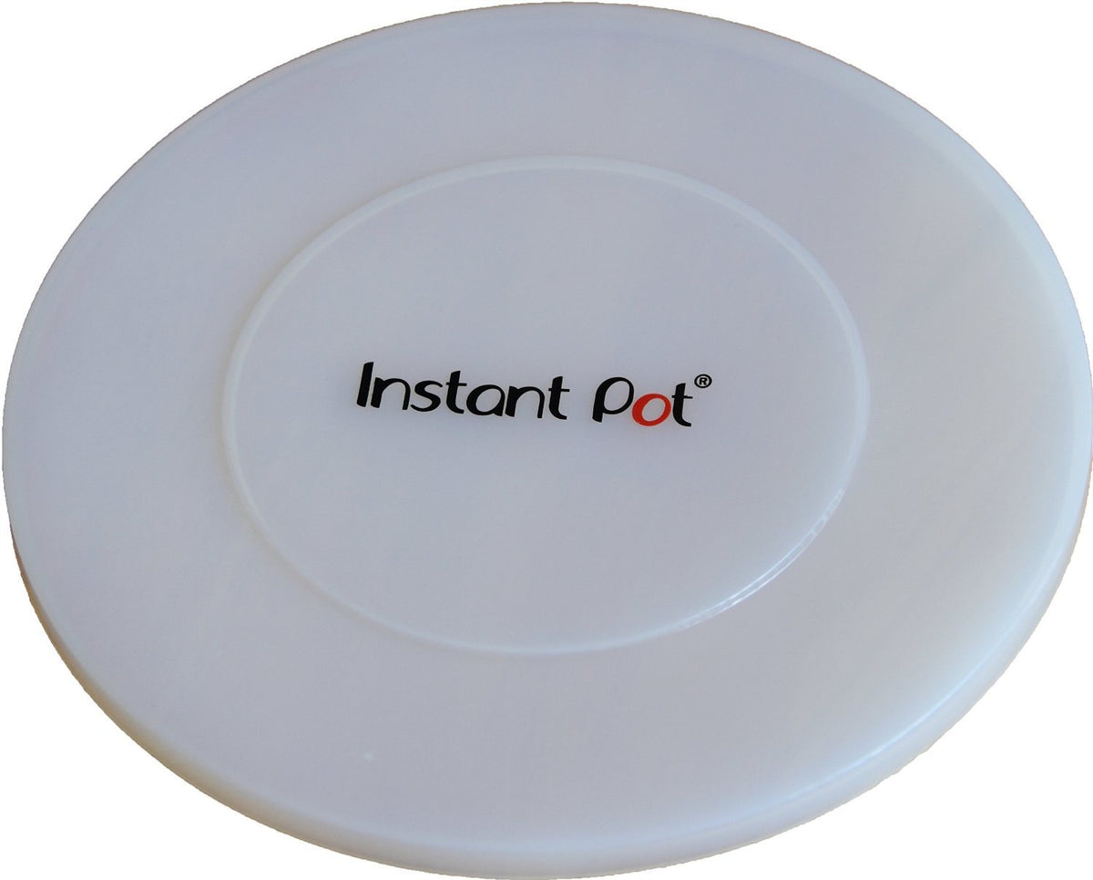 Instant Pot silicone lid in transparent white covering a pot with an airtight seal for leftovers.