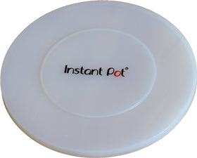 Instant Pot silicone lid in transparent white covering a pot with an airtight seal for leftovers.