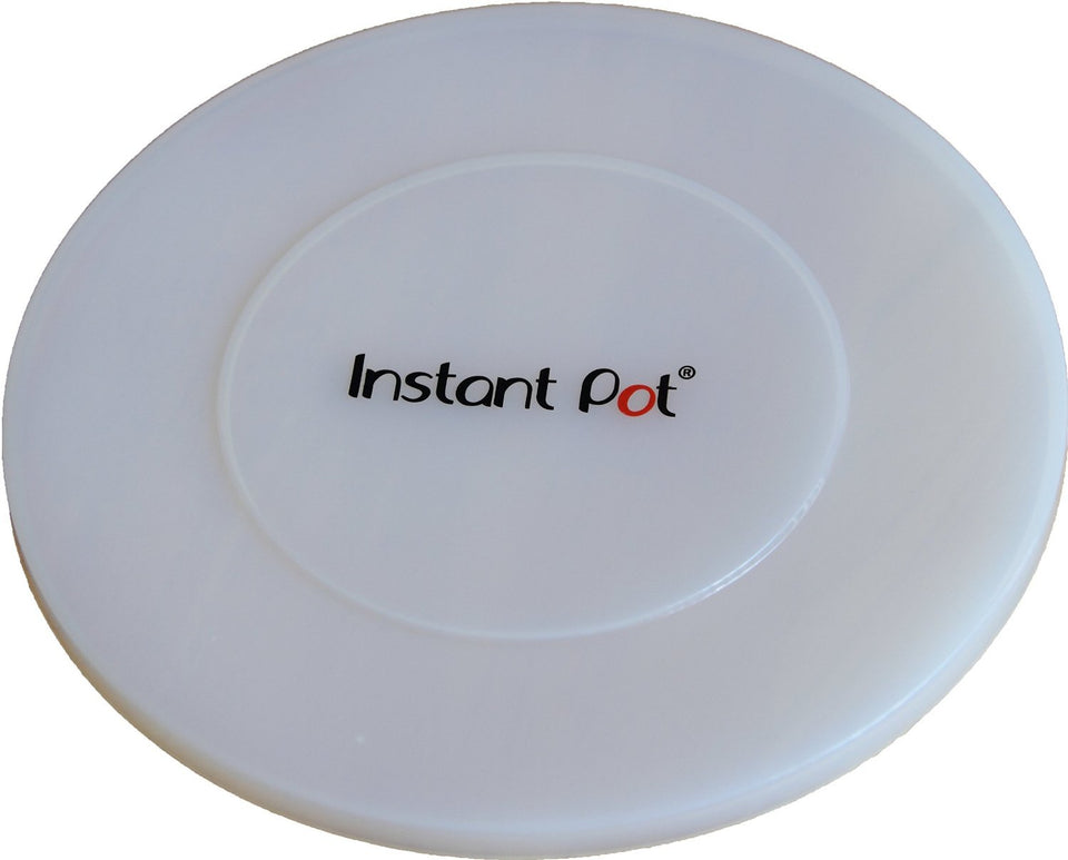 Instant Pot silicone lid in transparent white covering a pot with an airtight seal for leftovers.