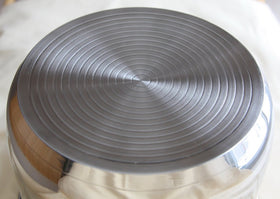 Instant Pot inner pot bottom shows tri-ply construction for even heating