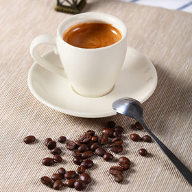 ionEgg porcelain cup glows softly under kitchen light, inviting morning rituals.