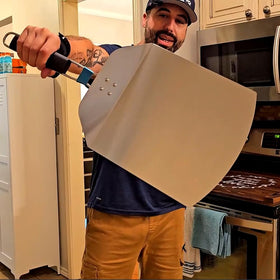 IQHLXN hanging storage design pizza peel for compact kitchen organization.