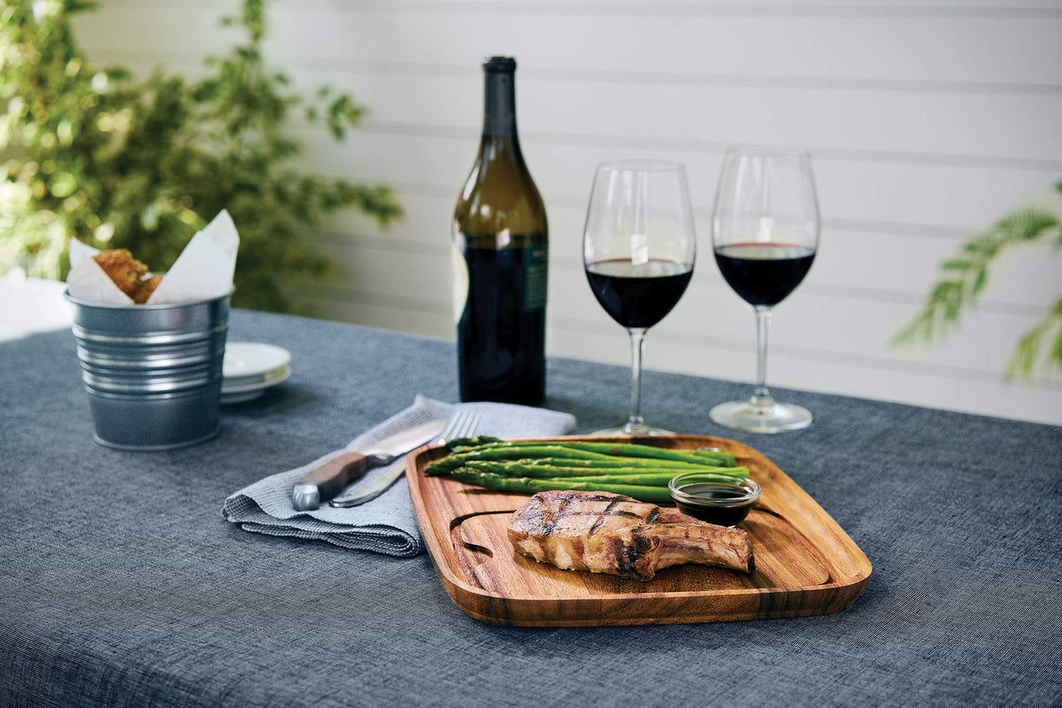 Ironwood Gourmet acacia wood board showing juice groove keeps juices contained.
