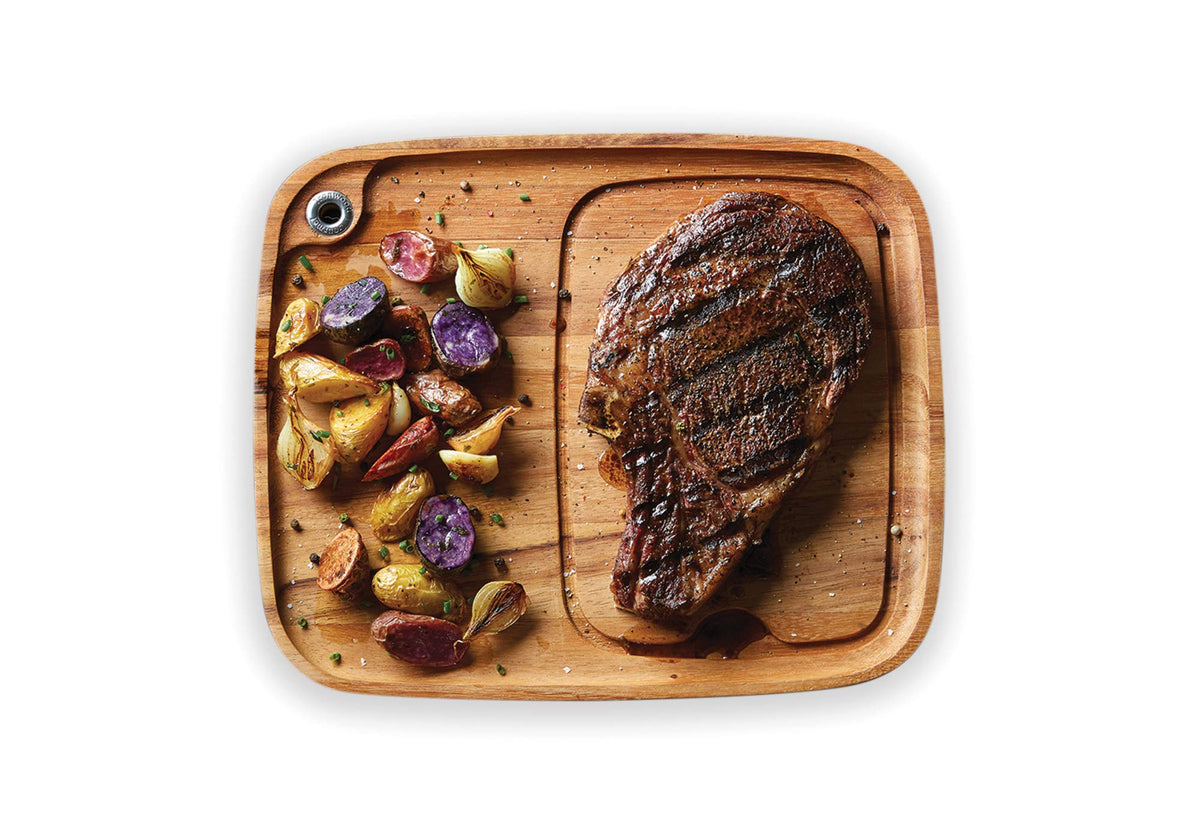 Ironwood Gourmet Fort Worth steak plate with juice channel for cleaner serving.