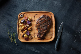 Ironwood Gourmet steak plate with grommet for wall display.