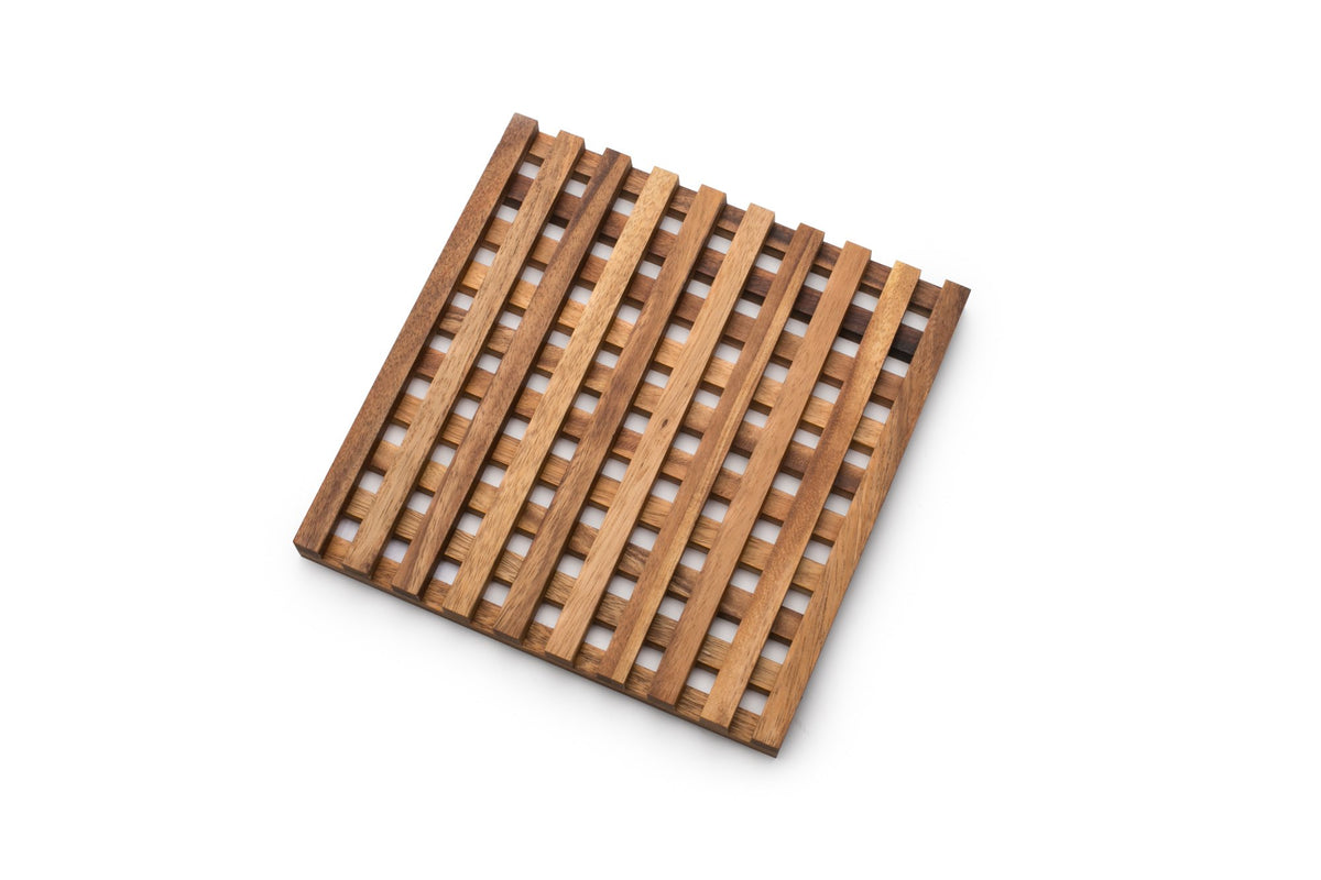 Venetian Trivet closeup of woven acacia pattern for stylish table presentation.