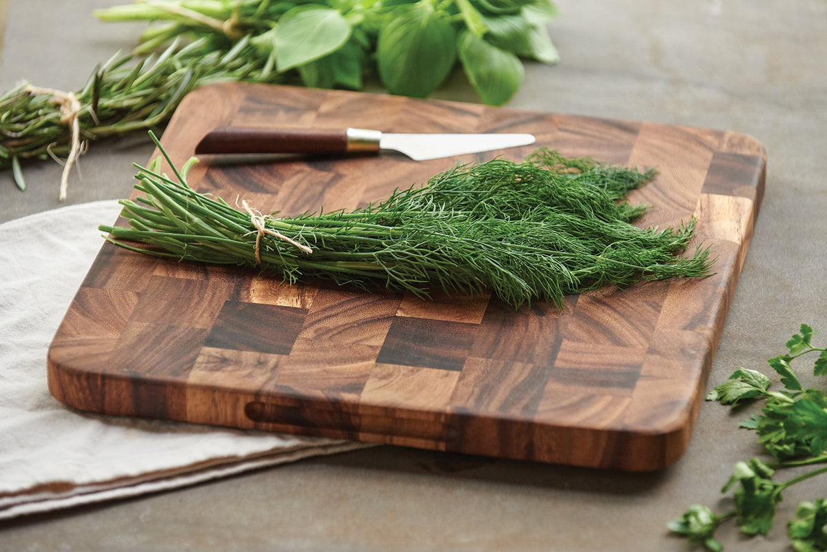 Ironwood Oslo acacia wood cutting board top view shows rich color patterns.