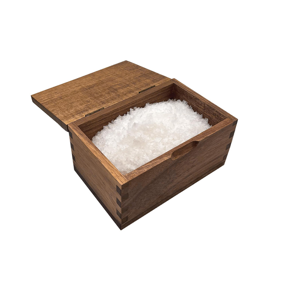 Itomoyo acacia salt cellar with flip lid for quick, one-handed seasoning.