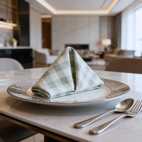 Ivy Heritage napkins framing a classic table setting with gingham charm.