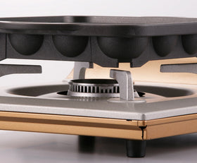 Side view of Iwatani pan highlights sturdy build and reliable heat distribution.