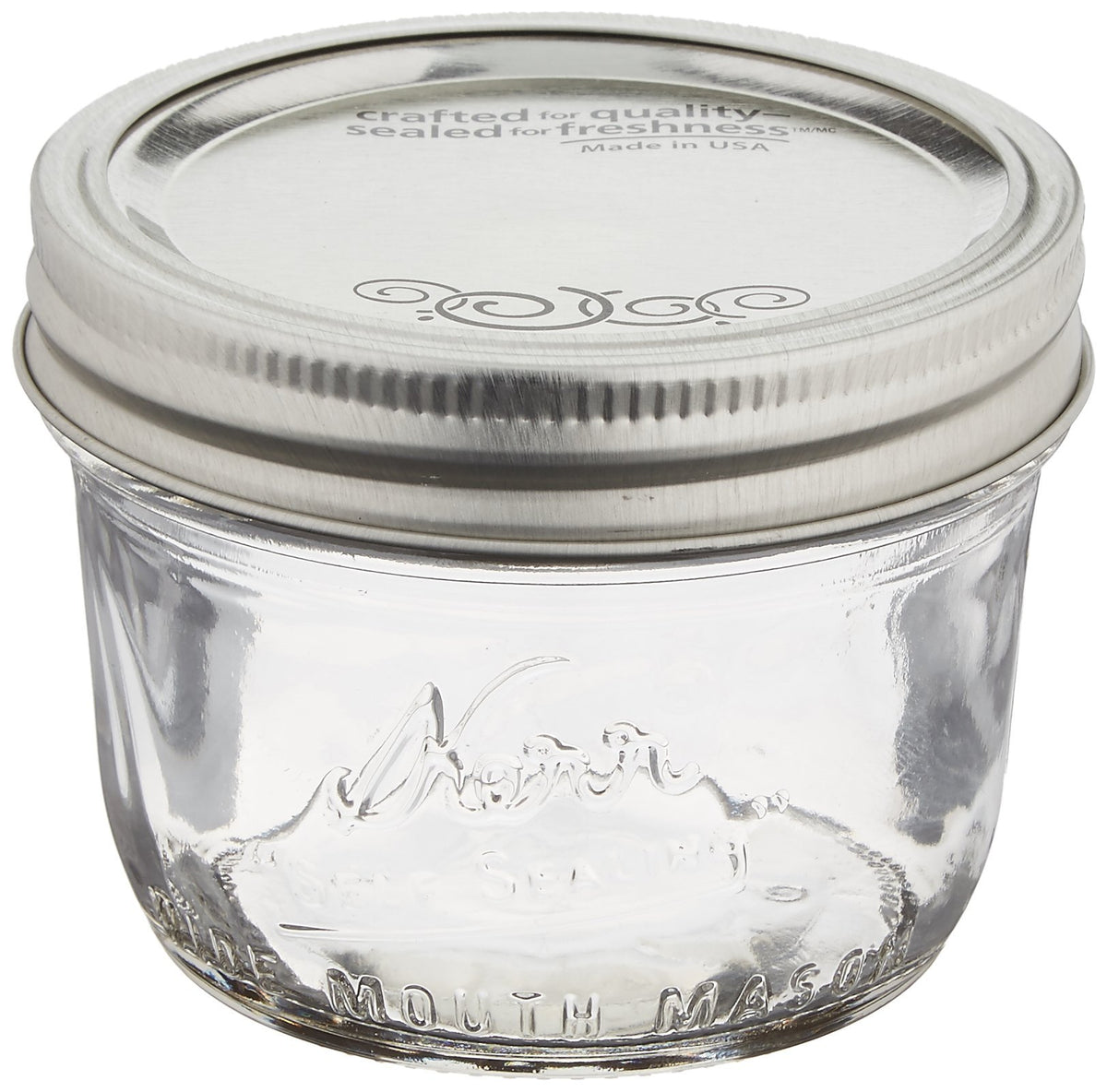 Jarden Kerr wide-mouth half-pint jar with lids and bands for fresh preservation and storage.