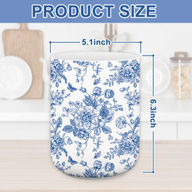JarThenaAMCS utensil holder with butterflies adds color while keeping tools within reach.