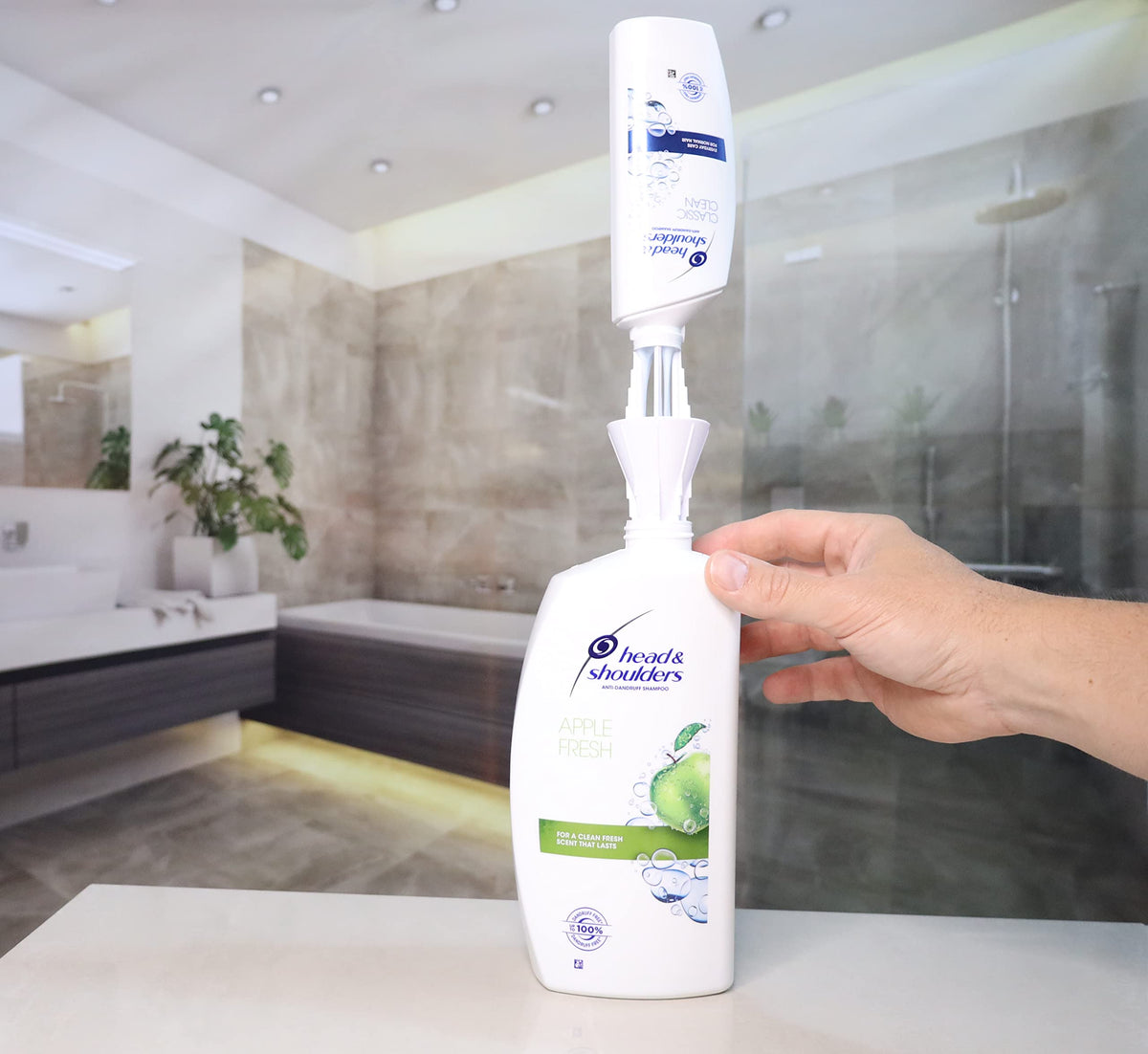 JCK Innovations universal bottle coupler transfer action enabling near-empty bottles to be reused