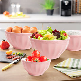 JCXivan mixing bowls with lids pink; microwave-safe for quick reheats.