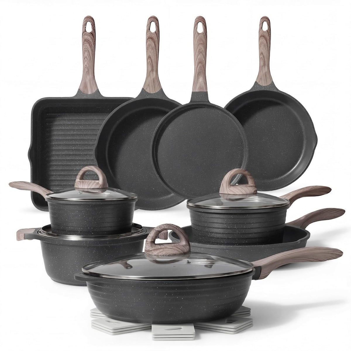 JEETEE 23-piece pots and pans set on induction stove delivering even heating.