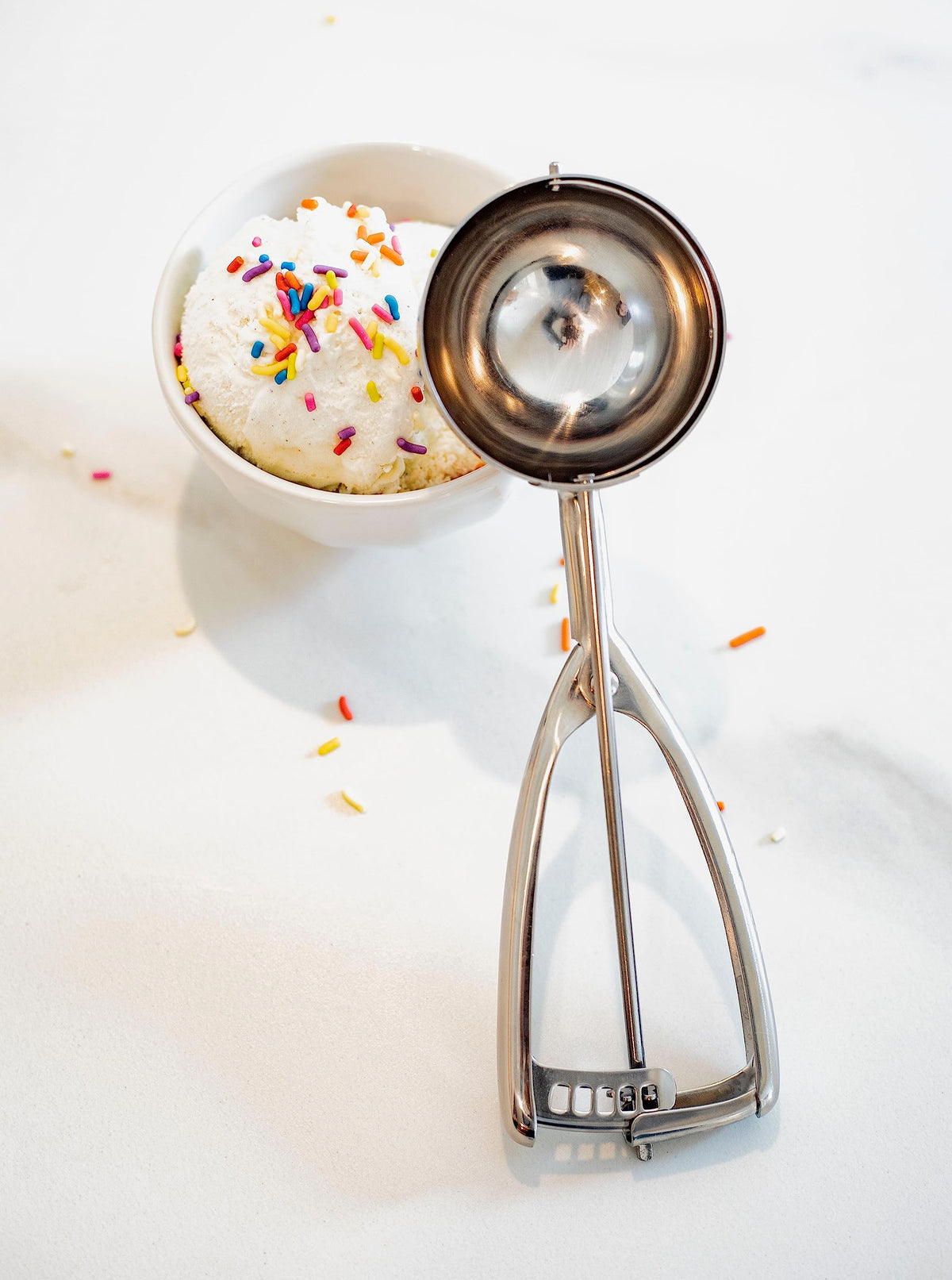 Jenaluca half-cup disher for even muffin batter portions.