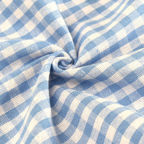 Jennice House tablecloth on a dining table creates a polished, inviting meal setting.