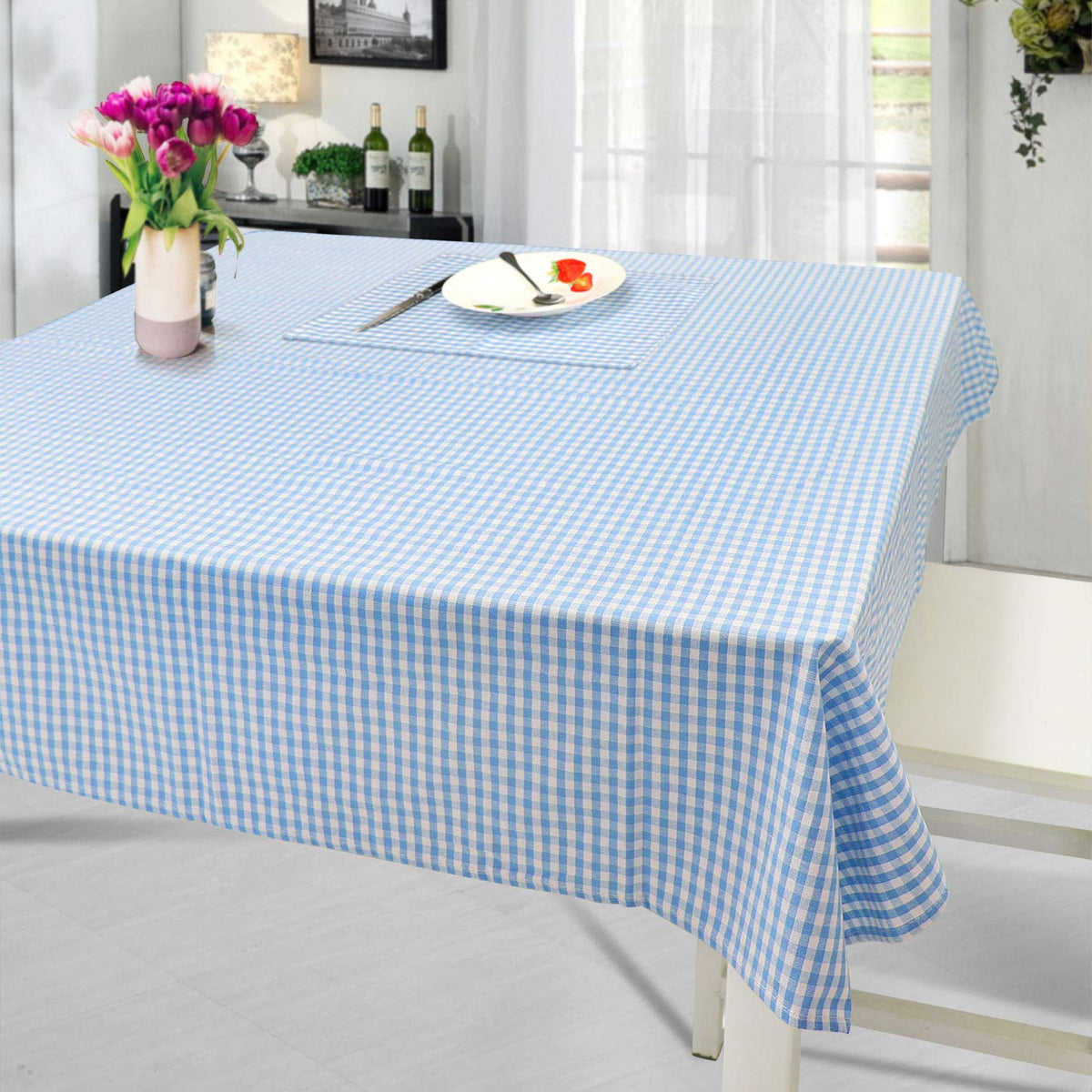 Jennice House outdoor picnic setup featuring the cotton tablecloth in blue.