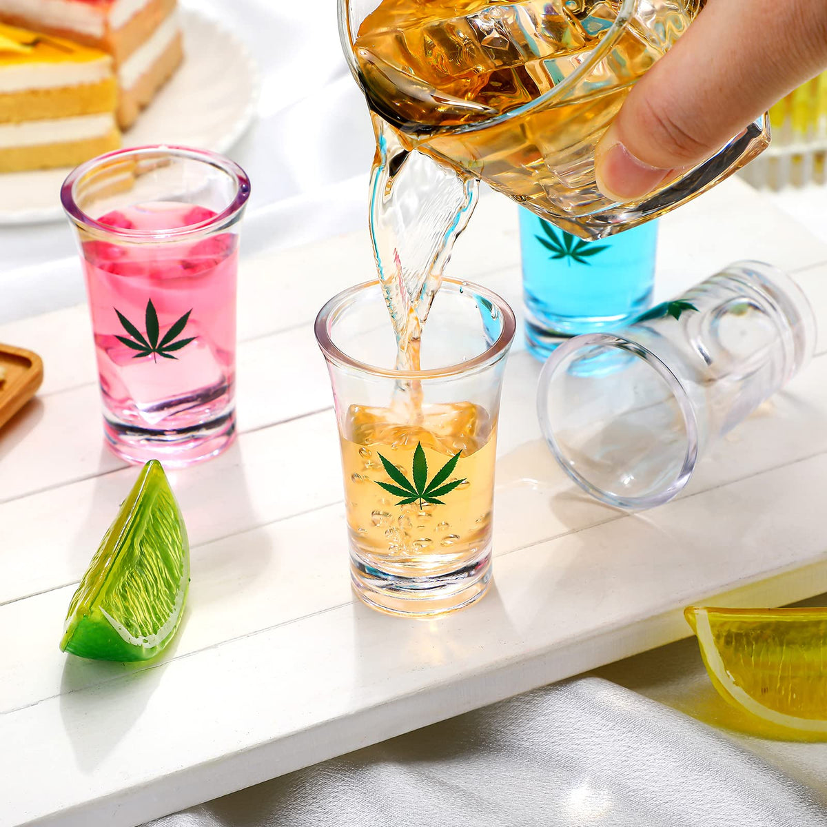 Jetec close-up of marijuana leaf print on acrylic shot glass for photos.