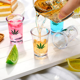 Jetec close-up of marijuana leaf print on acrylic shot glass for photos.
