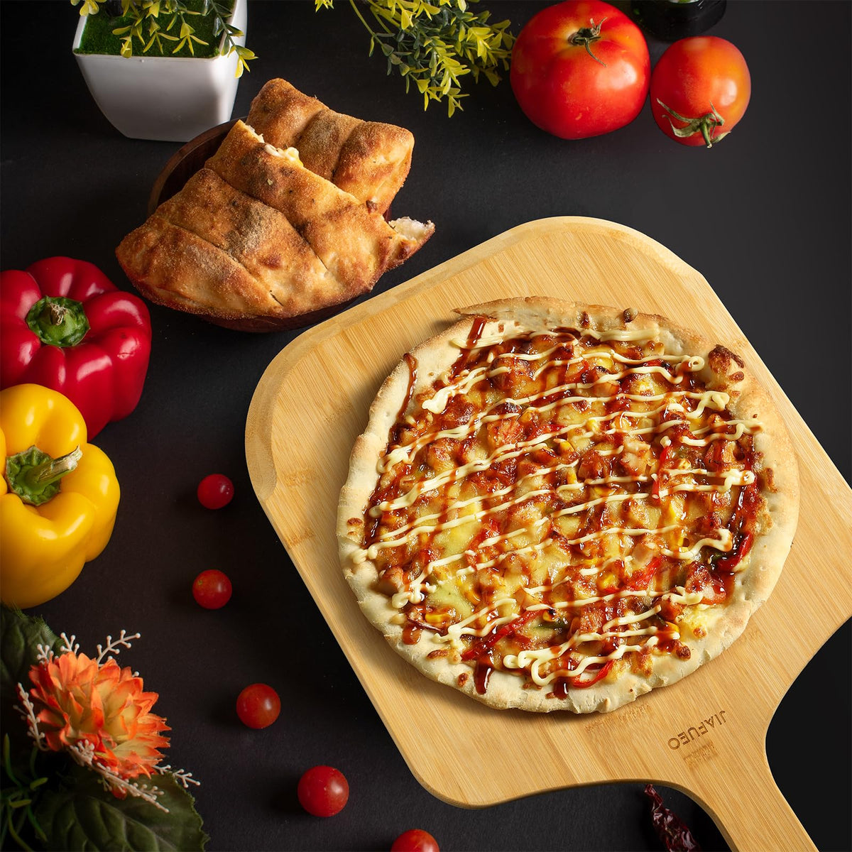 JIAFUEO pizza peel multipurpose board used as cutting board for fruits and bread.