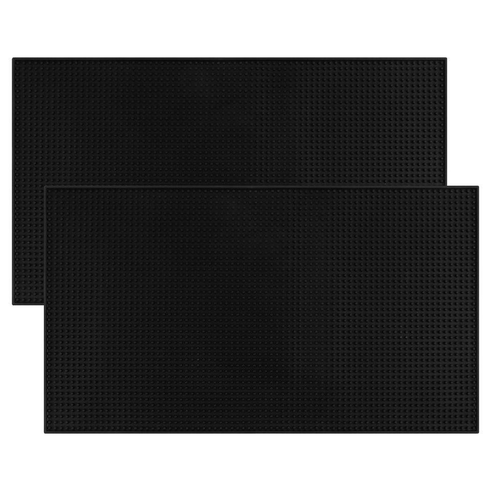 Jinmuxilll bar mat extra-large under a coffee machine to protect countertops and simplify cleanup.