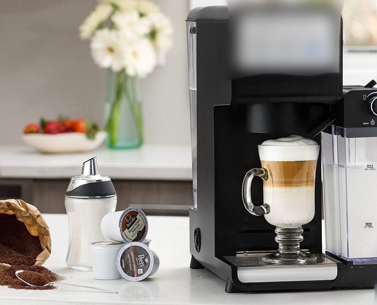 J&M DESIGN sugar dispenser at a coffee bar setup for everyday use.