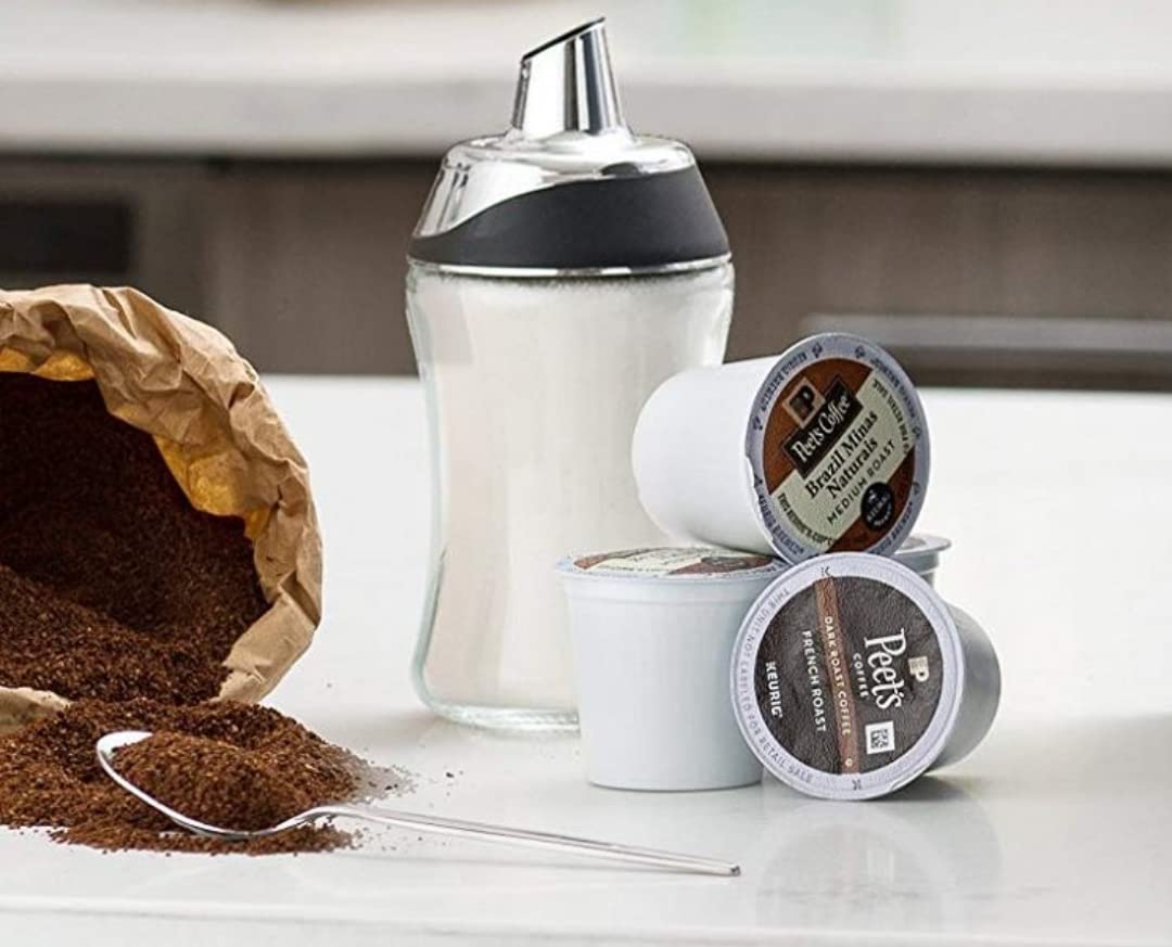 J&M DESIGN sugar dispenser on a modern kitchen countertop adds style and practicality.