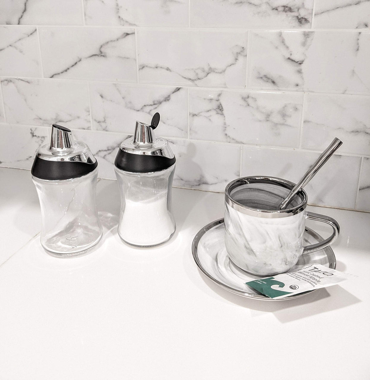 J&M DESIGN sugar dispenser provides a measured pour for consistent sweetness.