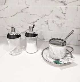 J&M DESIGN sugar dispenser provides a measured pour for consistent sweetness.