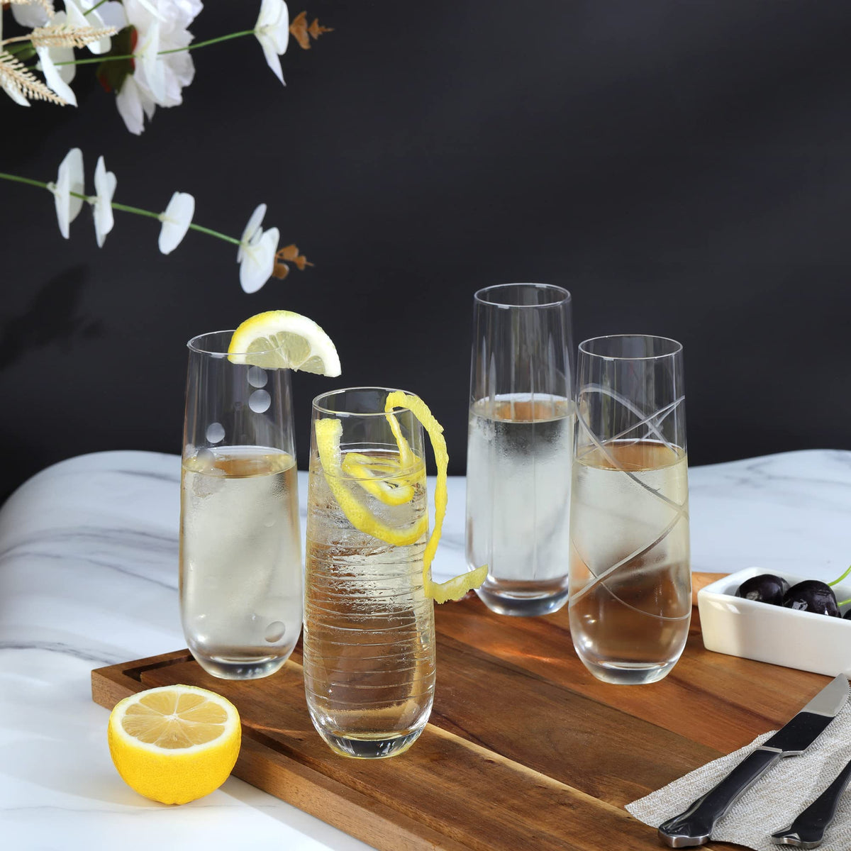 Joeyan etched champagne flutes with strips pattern elevate table aesthetics.