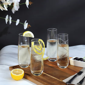 Joeyan etched champagne flutes with strips pattern elevate table aesthetics.