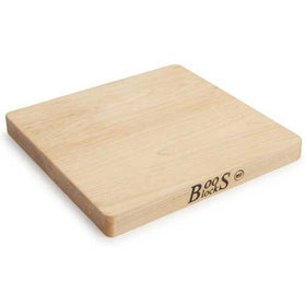 Two-handled sides with grips on John Boos Chop-N-Slice maple cutting board for easy maneuvering.