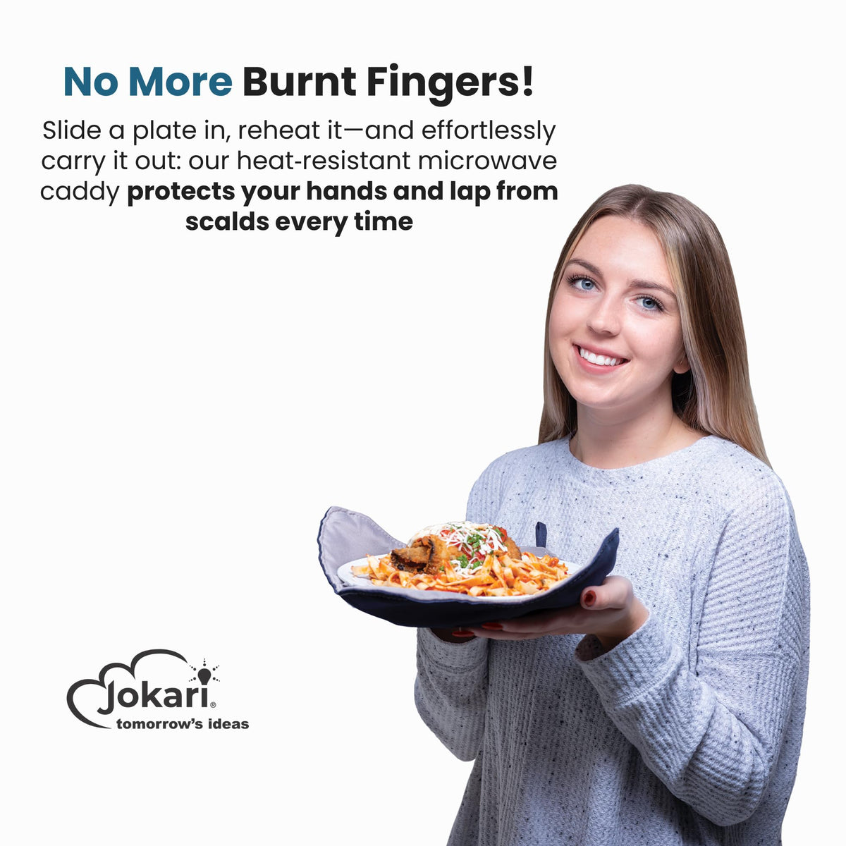 Jokari plate cozy being used to remove a hot plate from the microwave safely.