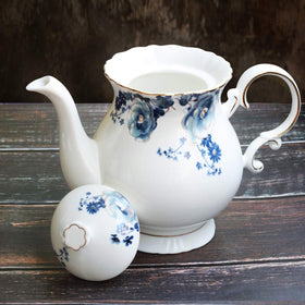 Jomop teapot close-up on gold trim emphasizing luxurious finish for gifts.