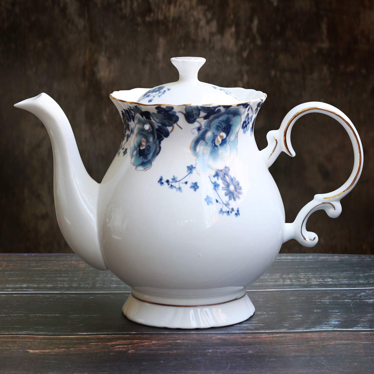 Jomop teapot with handle and spout angle showcasing ergonomic pouring and vintage charm.