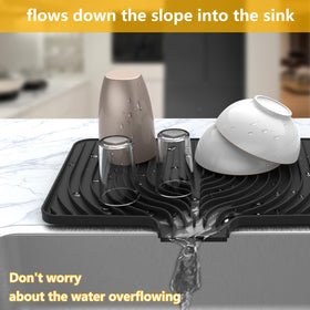 JOOKKI silicone drying mat on countertop with raised spout helps prevent spills