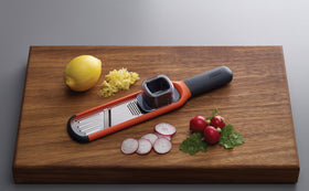 Joseph Joseph 2-in-1 Mini Grater & Slicer ergonomic handle supports comfortable grip.