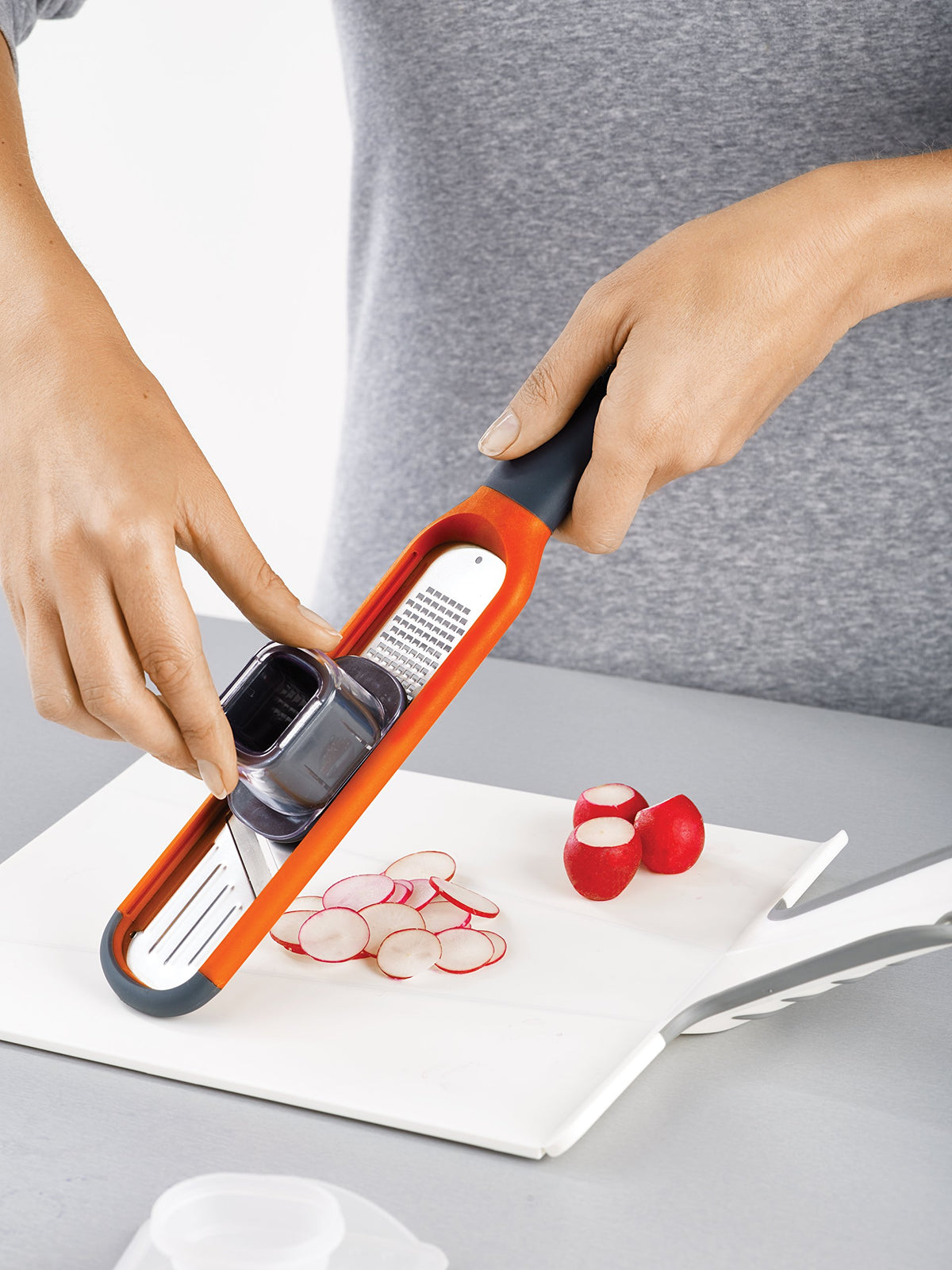 Joseph Joseph 2-in-1 Mini Grater & Slicer protective sheath for safe storage.